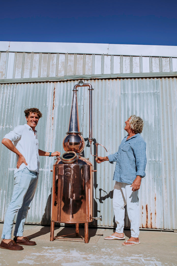 James and David in front of a still